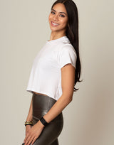 woman wearing white t-shirt on grey background
