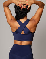 woman wearing crop top in ink navy on grey background