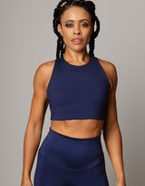 woman wearing crop top in ink navy on grey background