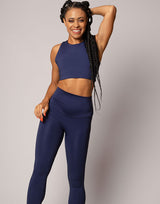 woman wearing crop top in ink navy on grey background