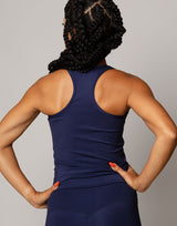 woman wearing tank top in ink navy on grey background