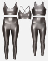 Metallic silver sports bra and leggings set on a light gray background