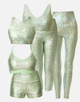 mint green sparkly sports bra, leggings, and shorts set on a white background