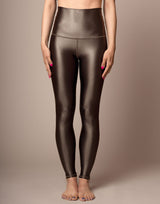 woman wearing high shine mocha color legging on grey background