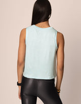 woman wearing tank top in cloud blue on grey background
