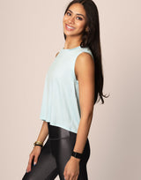 woman wearing tank top in cloud blue on grey background