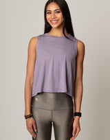 woman wearing lavender colored tank on grey background