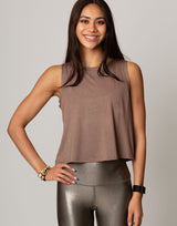 woman wearing toffee colored tank on grey background