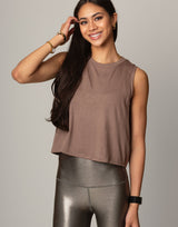 woman wearing toffee colored tank on grey background