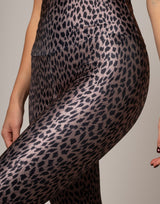 Leopard print pants being worn on a plain background