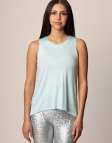 woman wearing light blue colored tank on grey background