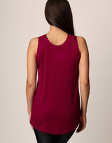 woman wearing tank top in merlot on grey background
