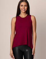 woman wearing tank top in merlot on grey background