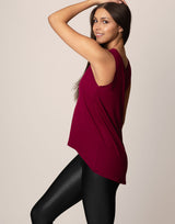 woman wearing tank top in merlot on grey background