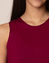 woman wearing tank top in merlot on grey background