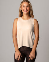 woman wearing vanilla ivory colored tank on grey background