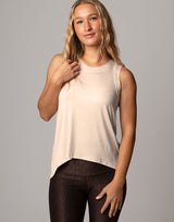 woman wearing vanilla ivory colored tank on grey background
