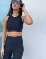 woman wearing chic woven star printed crop top on grey background