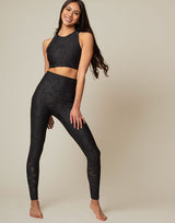 woman wearing chic woven star printed legging on grey background