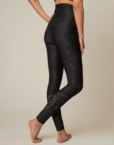 woman wearing chic woven star printed legging on grey background