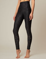 woman wearing chic woven star printed legging on grey background