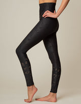 woman wearing chic woven star printed legging on grey background