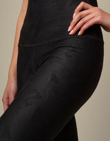 woman wearing chic woven star printed legging on grey background