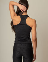 woman wearing chic woven star printed tank on grey background