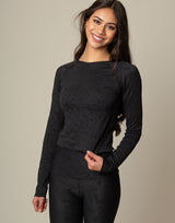 woman wearing long sleeve chic woven star printed sports top on grey background