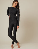 woman wearing long sleeve chic woven star printed sports top on grey background