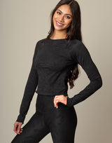 woman wearing long sleeve chic woven star printed sports top on grey background