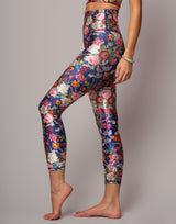 Floral leggings worn by a person on a gray background