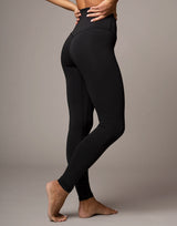 woman wearing legging in black on grey background