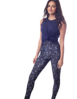 woman wearing tank top in navy on grey background