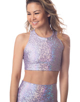 woman wearing crop top with mermaid pattern of lavender purple colored sparkling fish scales on grey background