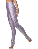 woman wearing long legging with mermaid pattern of lavender purple colored sparkling fish scales on grey background