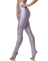 woman wearing long legging with mermaid pattern of lavender purple colored sparkling fish scales on grey background