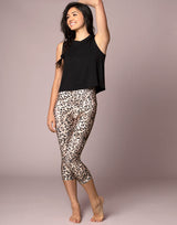 woman wearing tank top in black on grey background