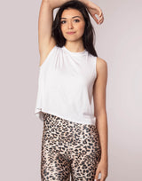 woman wearing tank top in white on grey background