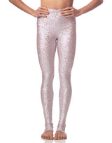 woman wearing long legging with mermaid pattern of pink colored sparkling fish scales on grey background