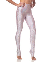 woman wearing long legging with mermaid pattern of pink colored sparkling fish scales on grey background