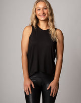 woman wearing tank top in black on grey background