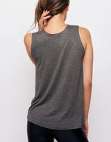 woman wearing tank top in charcoal grey on grey background
