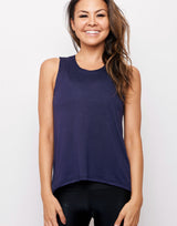 woman wearing tank top in navy on grey background