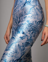 Blue and white floral patterned dress on a gray background