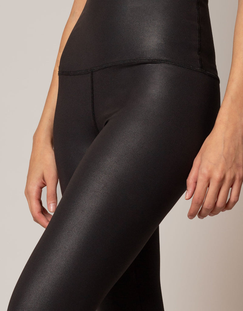 Black leggings worn by a person on a neutral background