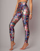 Floral leggings worn by a person on a gray background