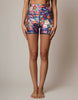 Floral patterned shorts worn by a person on a plain background